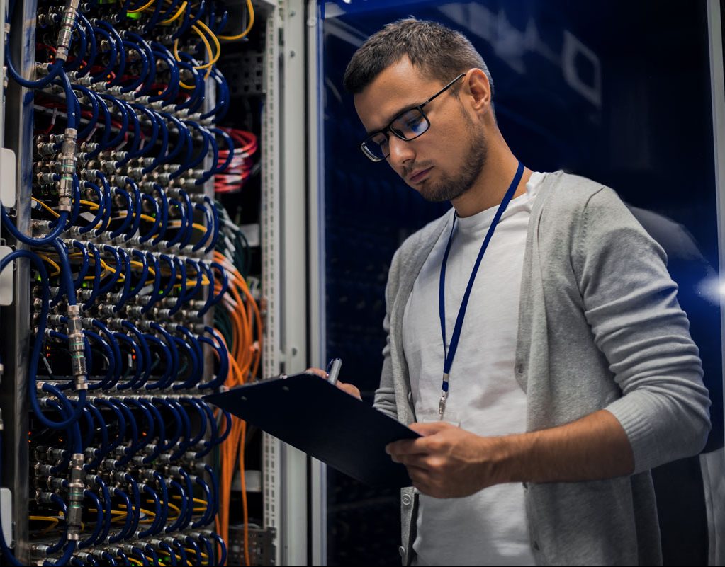 young-man-working-with-servers-3WGXVDR-e1613019490537.jpg